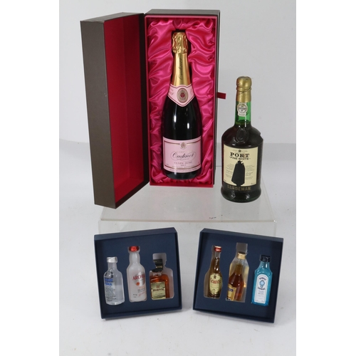 236 - Oudinot rose Champagne together with a Sandeman white port and two cruise presentation packs of mini... 