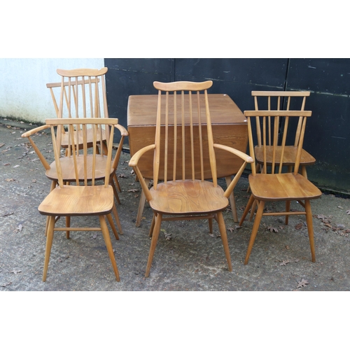 257 - Ercol drop leaf table together with six chairs measures approx. 74cm x 66cm unextended