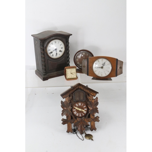 340 - An assortment of clocks including a cuckoo clock.