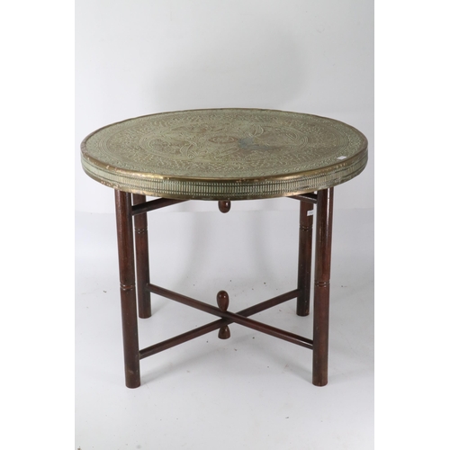 395 - Brass topped tiffin table measures approx. 60cm dia