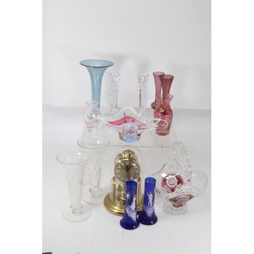 457 - A pair of glass candlesticks and an anniversary clock together with assorted glass.