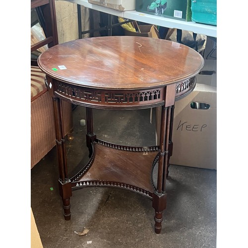 387 - Circular side table with fret work detail and shelf under