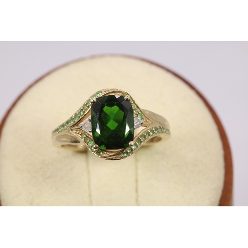 132 - 14k Gold emerald and diamond ring