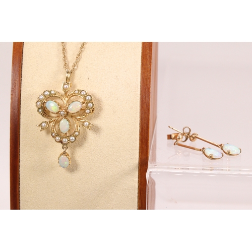 137 - 9ct gold chain with pendant set with opals and seed pearls and a pair of similar earrings.