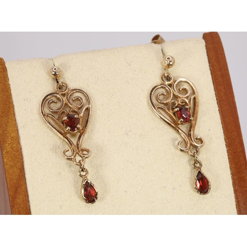 140 - 9ct Gold drop earrings set with garnets