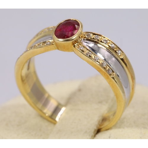 145 - 18ct yellow and white gold ring set with an oval ruby .68carat, and pave set with 20 .005carat diamo... 