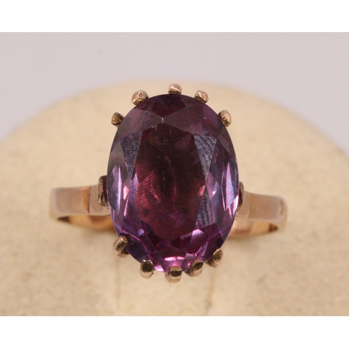 159 - A Sapphire 9ct gold dress ring, oval purple stone, 14mm x 10 mm approx.