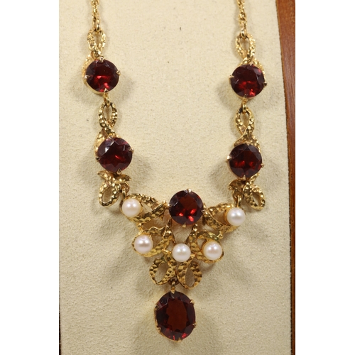 227 - 9ct gold necklace set with Garnets and seed pearl.