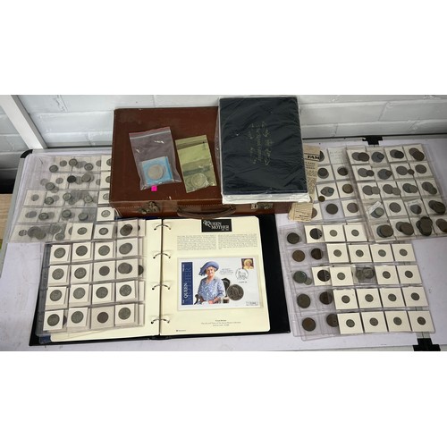 268 - Westminster album of coin covers together with a large selection of GB interest coins in a leather a... 