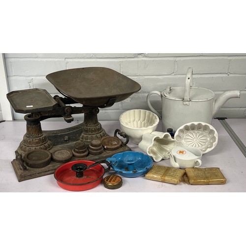 470 - Large set of scales, Jelly moulds, enamel water can, enamel candlestick, first aid packs etc