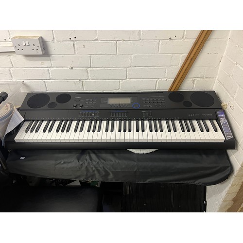 475 - A Casio Keyboard together with a Yamaha Clavinova and two stools