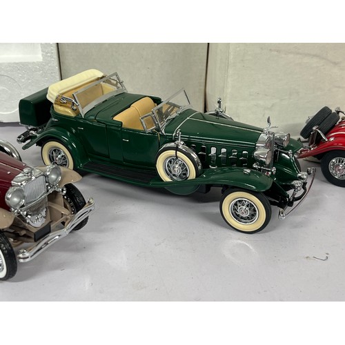 617 - Franklin Mint Mercedes 500K roadster together with 1930 Duesenburg and a Danbury Mint Cadillac