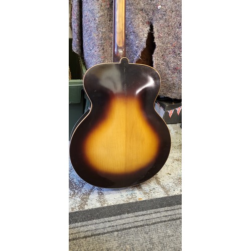 478 - A vintage tobacco sunburst accoustic Jazz guitar with hard fitted cast