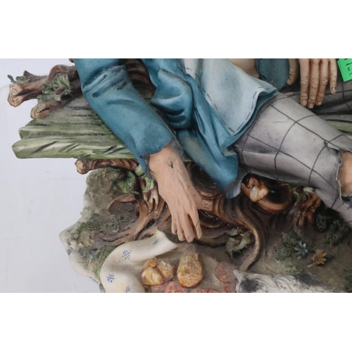 64 - A Capodimonte figure of a tramp, together with four similar figurines. Note - restoration to hand on... 