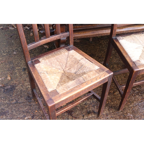 118 - Refectory Oak table together with six chairs fitted rush seats