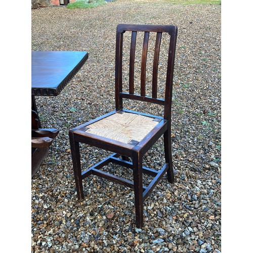 118 - Refectory Oak table together with six chairs fitted rush seats