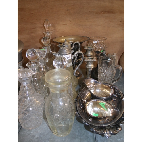 239 - A quantity of plated ware to include Champagne bucket, and several cut glass decanters