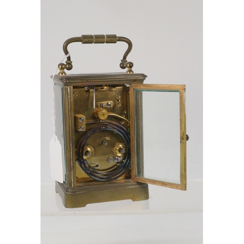 104 - A Hollinshed, Jersey brass cased striking carriage clock