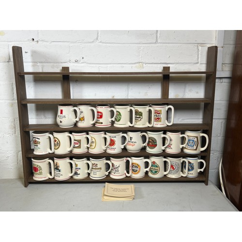 398 - Official tankards of the worlds great breweries by Franklin Porcelain, with wooden rack