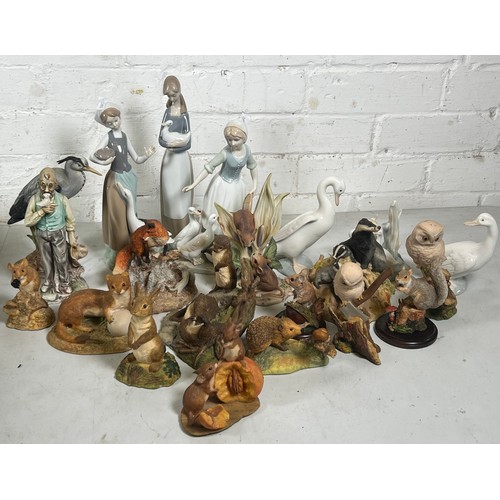 433 - A Lladro figurines, Nao similar and a selection of Aynsley wildlife animals, and other