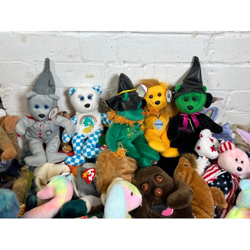 499 - A large selection of assorted TY beanie babies to include some Wizard of Oz celebrity bears.