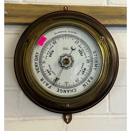 514 - Circular brass cased aneroid wall barometer