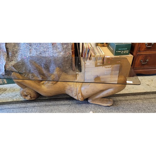 439 - Large carved nude female sculpture together with glass top to make into a coffee table (measures app... 