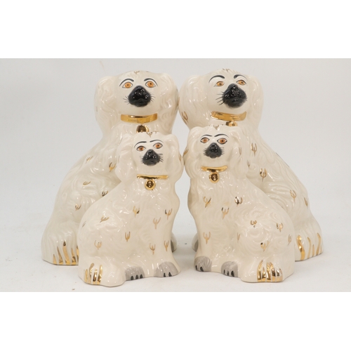 484 - Two Beswick Staffordshire Spaniels (approx. 19cm tall) together with two smaller Royal Doulton Staff... 