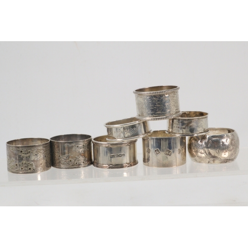 141 - Six silver hallmarked napkin rings (approx. 175g) together with two plated napkin rings