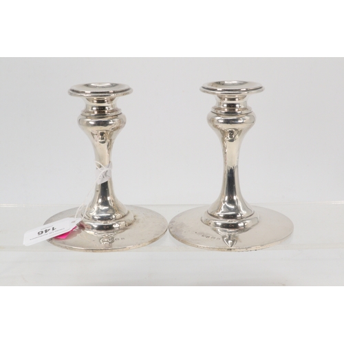 146 - Pair of weighted silver hallmarked candlesticks (height approx. 12.5cm)