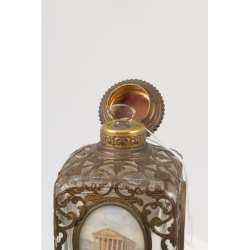 163 - A Grand Tour gilt and glass perfume bottle with four panels, lid is a little squashed