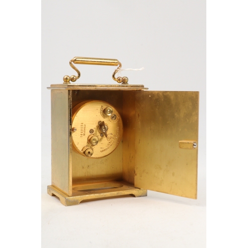 187 - A Brass cased carriage clock marked Tiffany & Co to the front with 8 day swiss movement, case also s... 