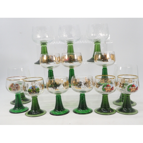 474 - A selection of wine glasses with green stems, some have etched decoration