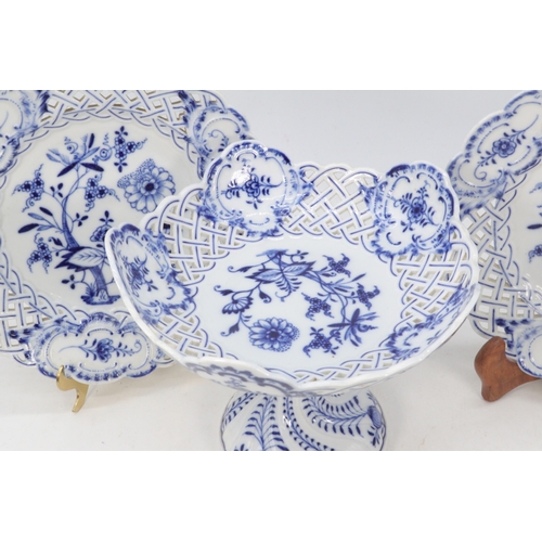 491 - A pair of Meissen blue onion pierced plates together with a comporte