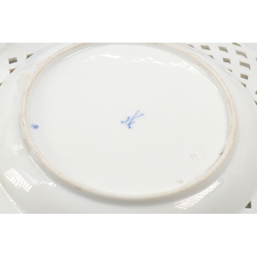 491 - A pair of Meissen blue onion pierced plates together with a comporte