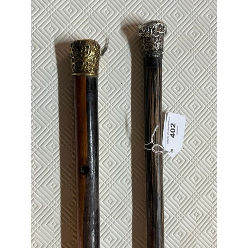 402 - Two walking canes one with silver top