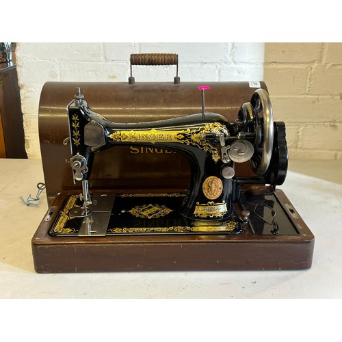 487 - Cased singer hand wind sewing machine with slipper bobbin