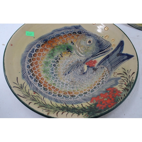 106 - Two Diaz Costa plates decorated with fish sign DC to both plates