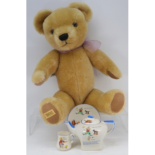 208 - Merrythought Bear, together with Nursery Child's tea pot, saucer and jug by Corona ware (crazed)