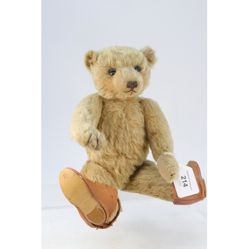 214 - Vintage jointed, straw filled teddy bear with hump to back, approx. 32cm high