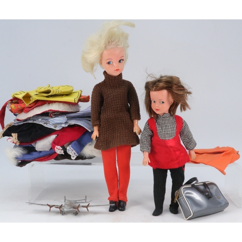 219 - A 1960's Sindy doll together with a Patch doll, quantity of clothing and a diecast Dinky plane