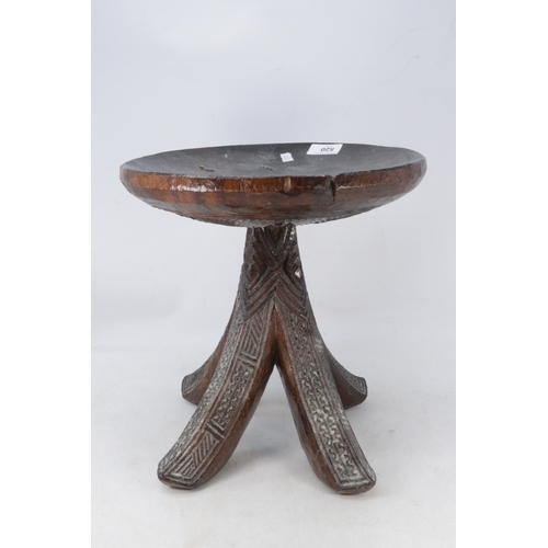517 - A heavily carved tribal igbo stool