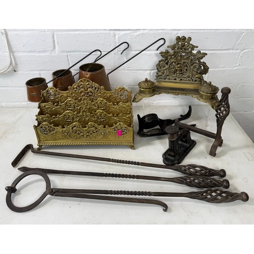 530 - Brass ornate letter rack together with a similar desk standish, copper measures and fireside impleme... 