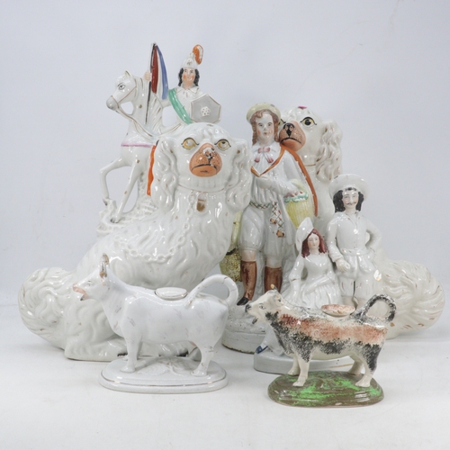 384 - A pair of Staffordshire Spaniels, flat back figures, two cow creamers etc (examine)