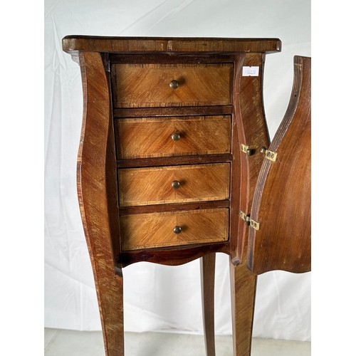 363 - A petite bombe shaped side cupboard with single door and four fitted drawers inside (hinge is a/f)