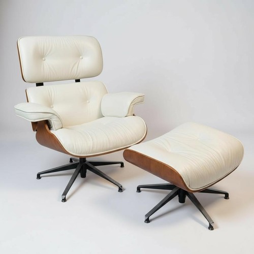 547 - A Chair in the style of Eames with footstool, showing some general wear