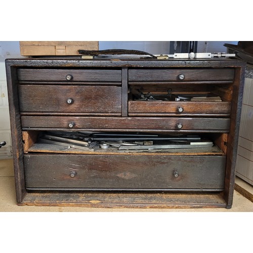 521 - Engineers wooden toolbox in need of repair containing assorted tools, drill bits, etc (large draw fr... 