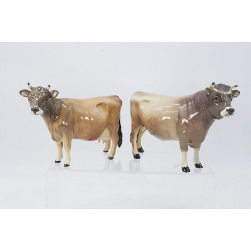 67 - Two Beswick Guernsey Cows, one stamped CH Dunsley Coy. Boy and the other Newton Tinkle