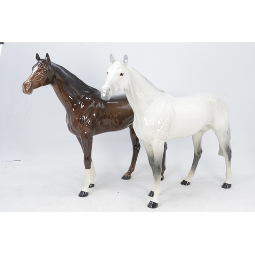 168 - A Beswick Dapple Grey horse together with a brown horse