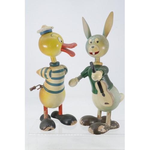 511 - Two mid 20th Century wooden screw top Spanish money boxes by Goula with locks by RGM in the form of ... 